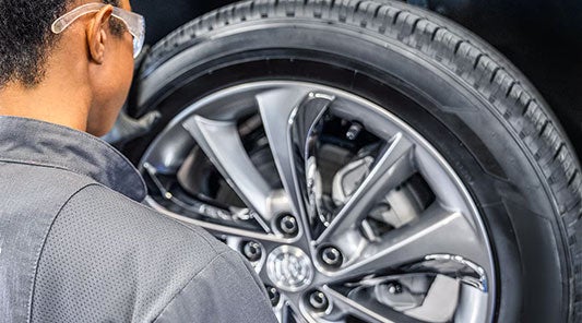 service expert replacing tire