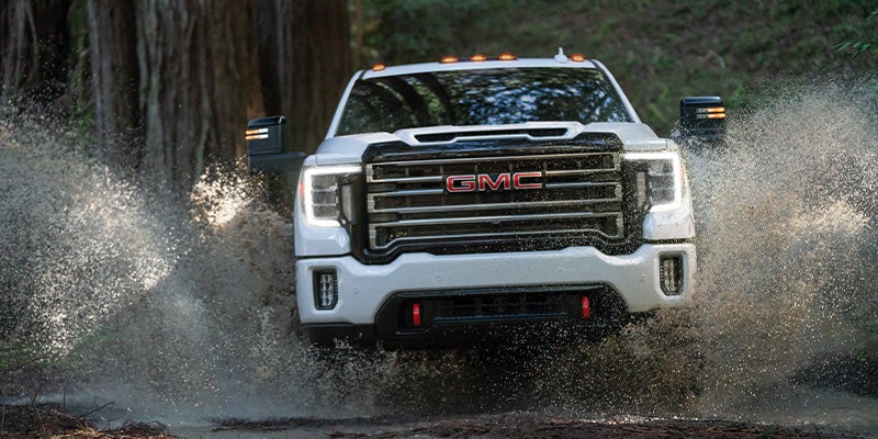 GMC Sierra 2500 going through water and splashing