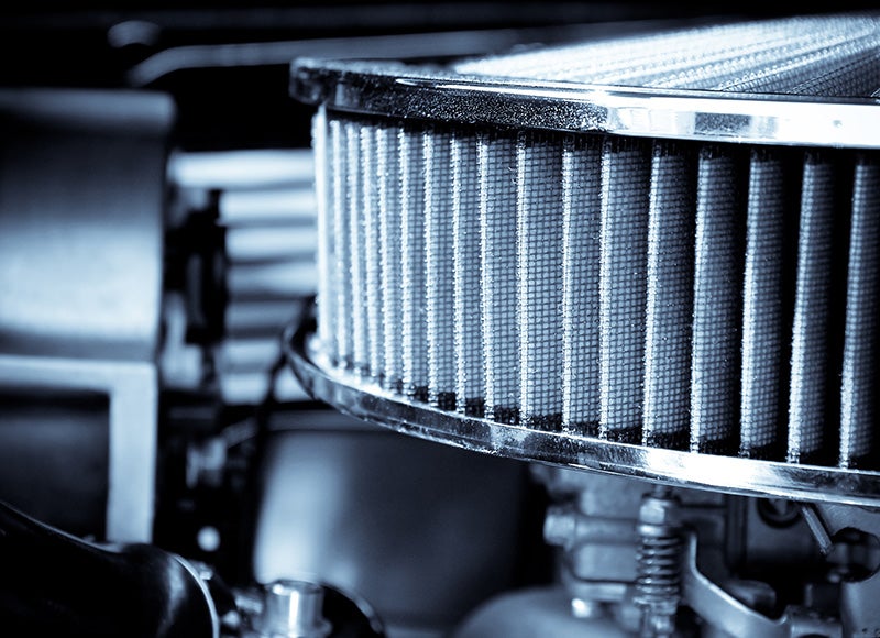 Close-up of a clean car air filter in the engine bay